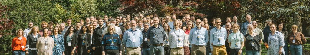 Viper team stood for group photo in front of trees